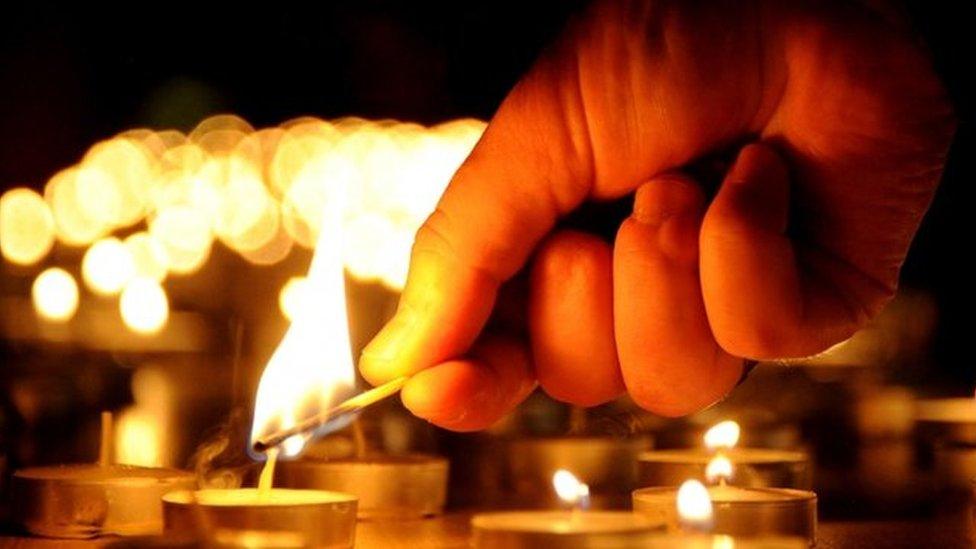 Candles being lit on Holocaust Memorial Day