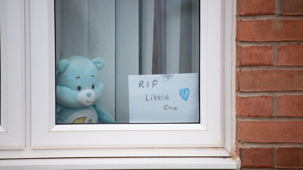 A house displays a sign stating "RIP Little One" on Vashon Drive in Droitwich, Worcestershire