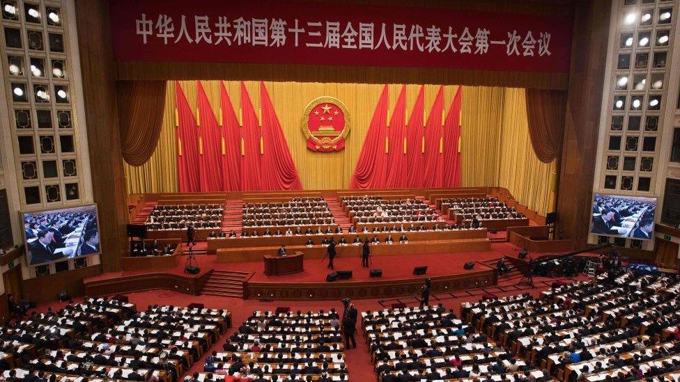 A general view shows the fourth plenary session of the National People's Congress (NPC) with China's President Xi Jinping (centre, 2nd row from front) at the Great Hall of the People in Beijing on March 13, 2018.