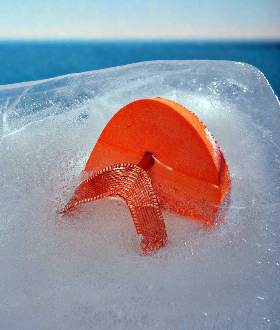 A flip flop frozen in ice