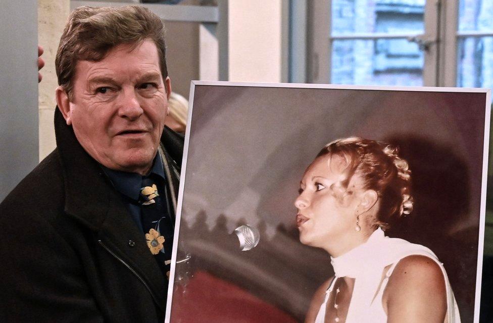 Jacky Kulik, the father of Elodie Kulik who was raped and murdered in 2002, poses with a portrait of his daughter on November 21, 2019 at the courthouse of Amiens