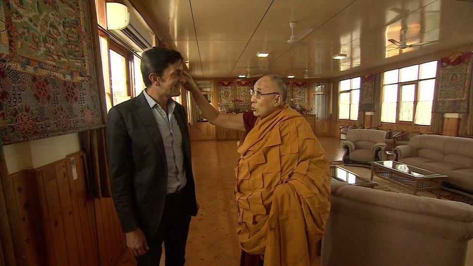 BBC correspondent Justin Rowlatt (L) meets the Dalai Lama