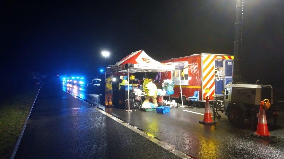 Salvation Army giving out food and drink on the M20