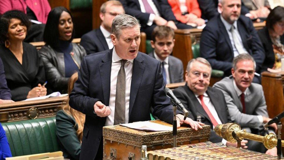 Labour leader Sir Keir Starmer seen speaking in the House of Commons. Labour MPs can be seen in the background.