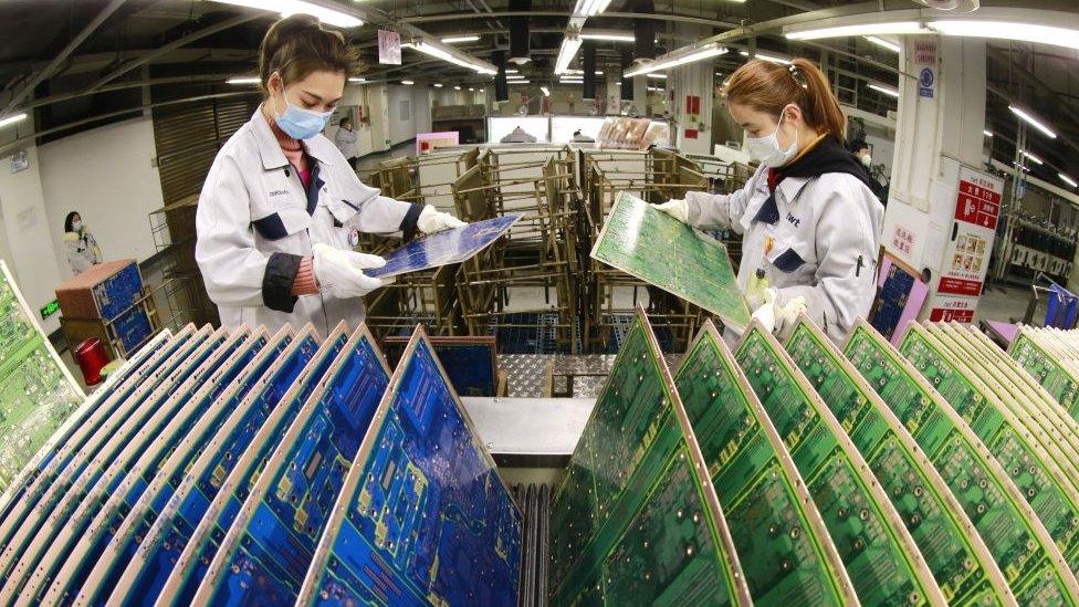 Workers at a Taiwanese-owned tech factory in China