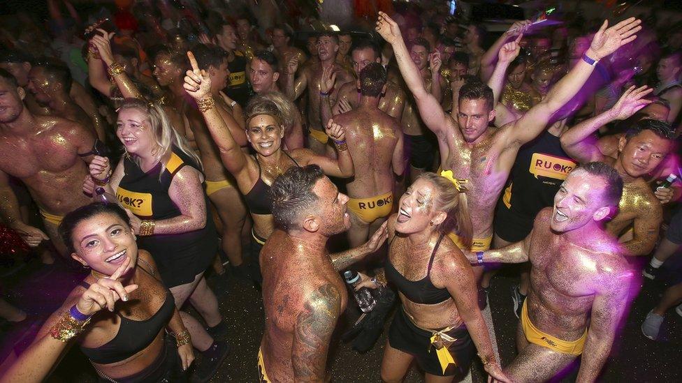 Participants dance before for the annual Gay and Lesbian Mardi Gras parade in Sydney, Saturday, March 4, 2017.