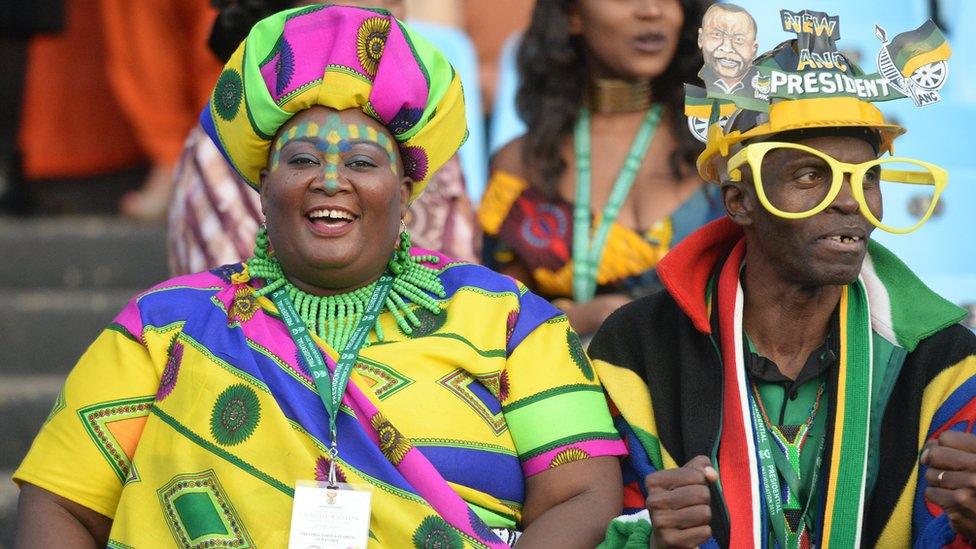 People in the crowd wearing colourful clothes