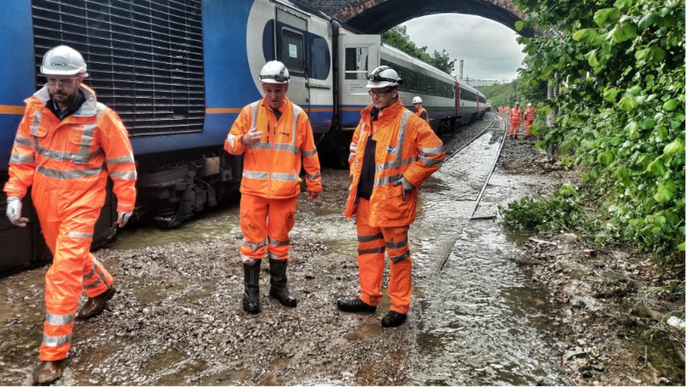 Workmen at site of stranded train