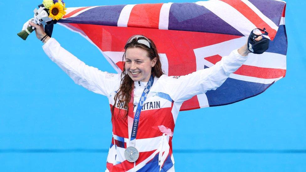 Georgia Taylor-Brown waves a British flag