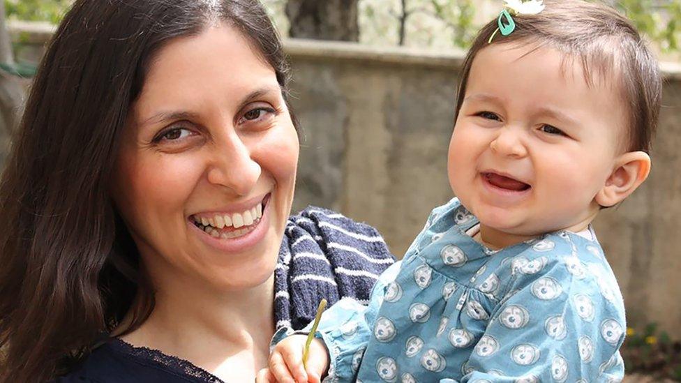 Nazanin Zaghari-Ratcliffe (L) posing for a photograph with her daughter Gabriella