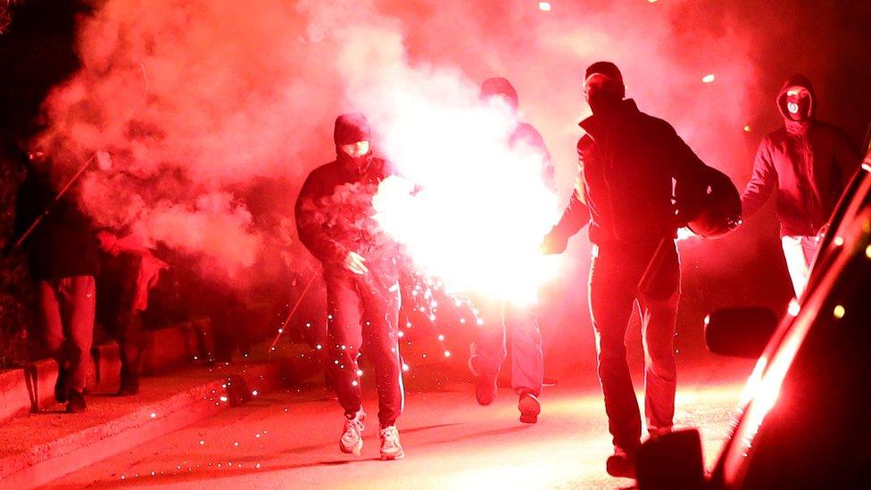 Demonstrators clash with riot police in Nea Smyrni, a southern district of Athens