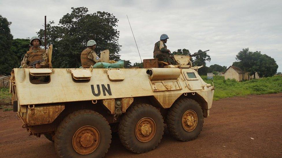 UN peacekeepers on patrol in an armoured tank