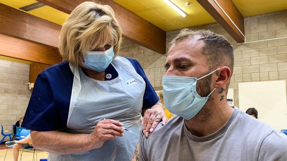 A man receives a coronavirus vaccination