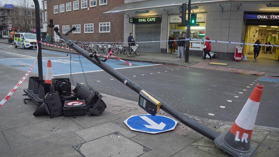 Knocked down traffic light post outside Oval station