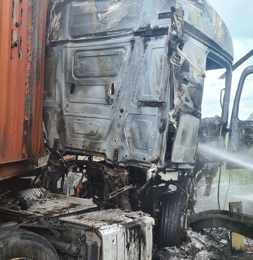 A burnt out lorry on the M1 in Luton