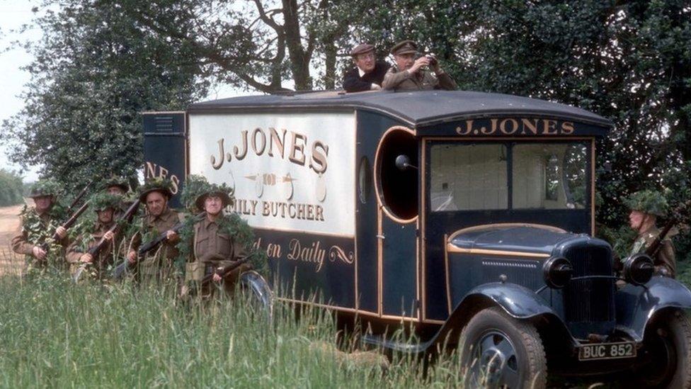 Picture shows: A scene from the "Dad's Army" episode 'Wake Up Walmington'. L-R: Unknown extras, Edward Sinclair as Maurice Yeatman the Verger (appearing out the top of the van to the left) and Geoffrey Lumsden as Captain Square