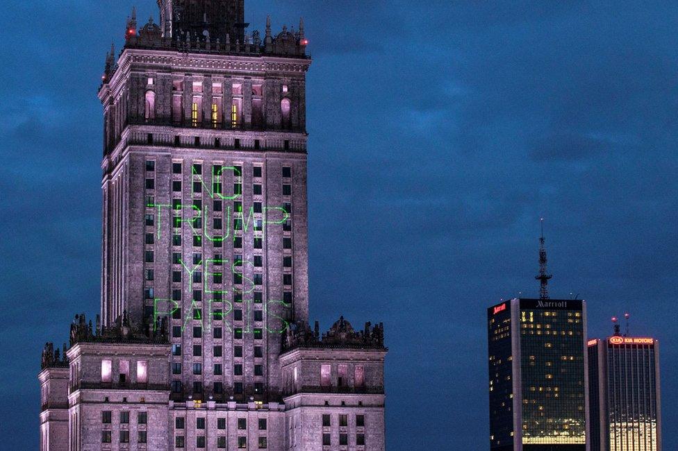 Greenpeace activist illuminate the Palace of Culture and Science with words "No Trump Yes Paris" in Warsaw, Poland, 5 July