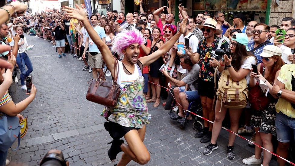 Man-celebrates-winning-high-heel-race-in-Madrid.