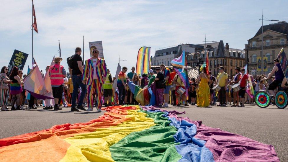 People in the Isle of Pride parade on Douglas Promenade