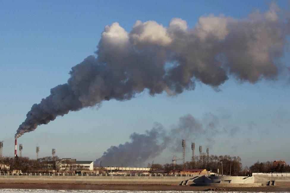 Smoke belches out from a heating factory in Heihe, north-eastern China, 22 November 2015