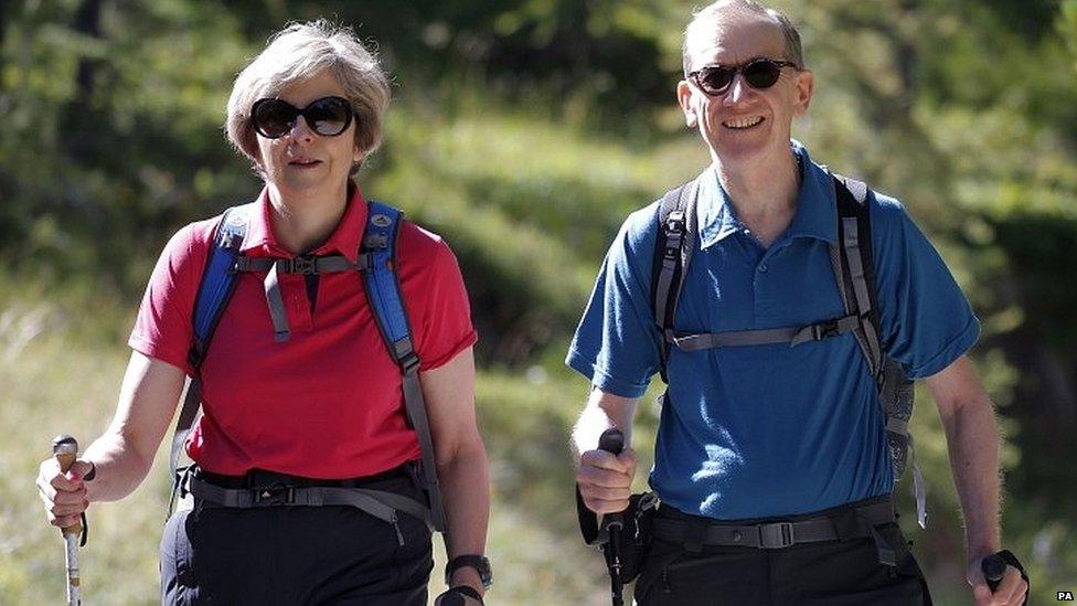 Theresa and Philip May walking in Switzerland