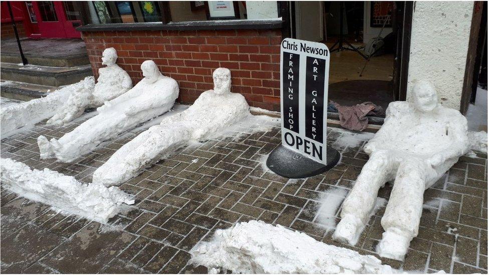 Snow figures on ground