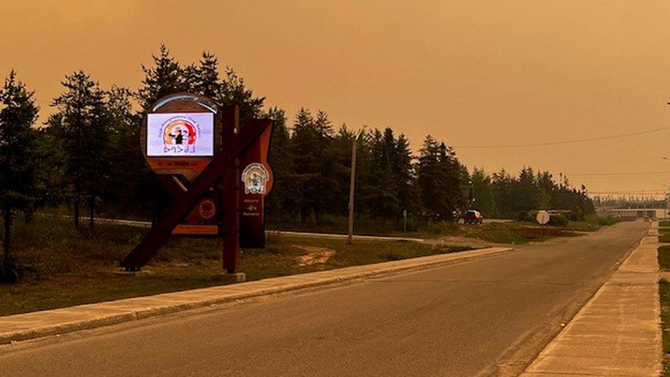 Photo of orange skies over Ouje-Bougoumou