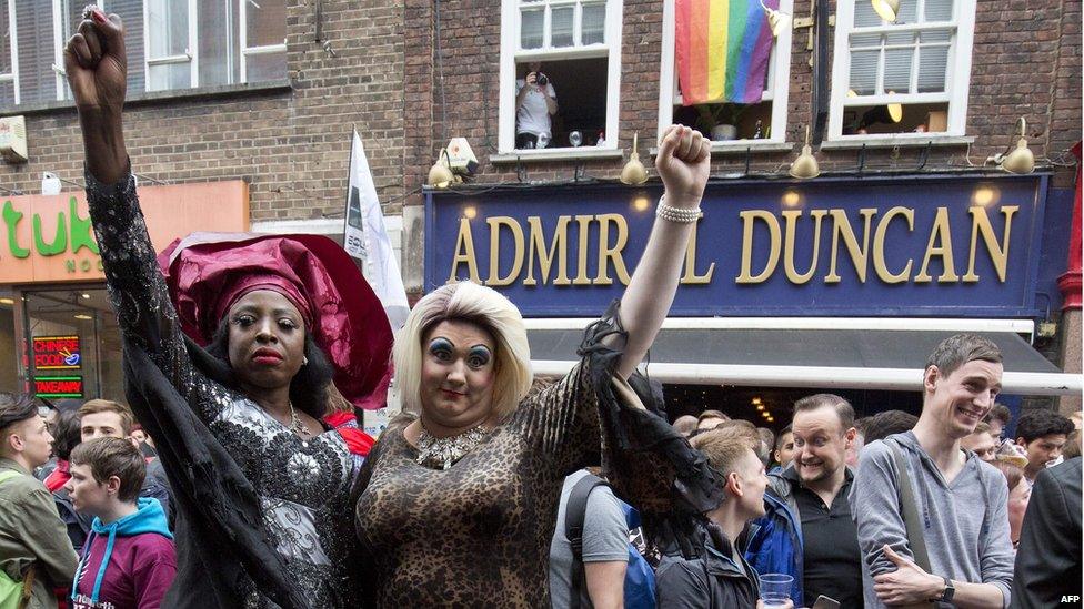 People gather in Soho, London