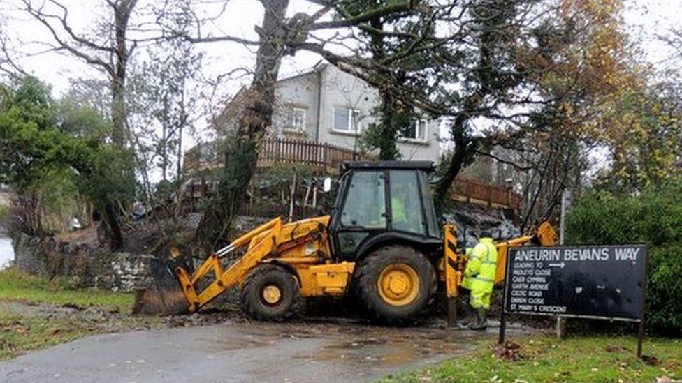 A digger helps with the clear-up in Maesteg on Monday