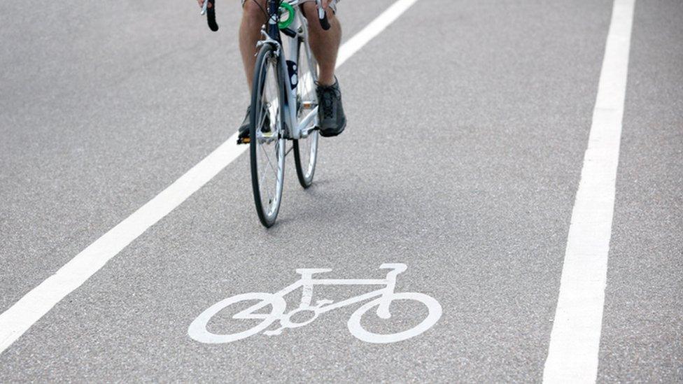 Person riding a bicycle on cycle path