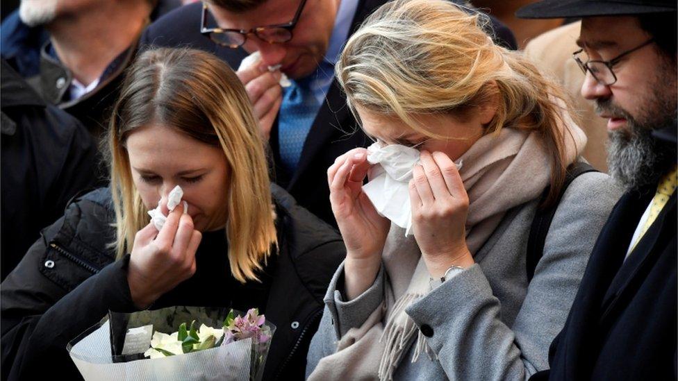 Members of the public at a vigil for victims of a fatal attack on London Bridge in London