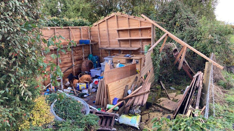 A shed that has been destroyed by the storm