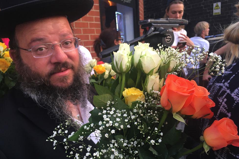 Orthodox Jewish man with roses