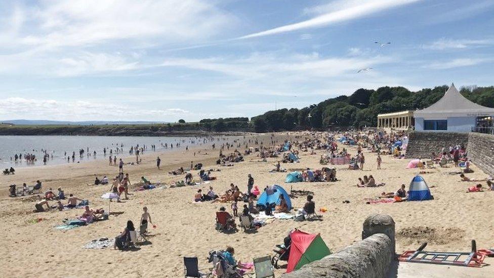 Enjoying the beach in the sunshine at Barry Island