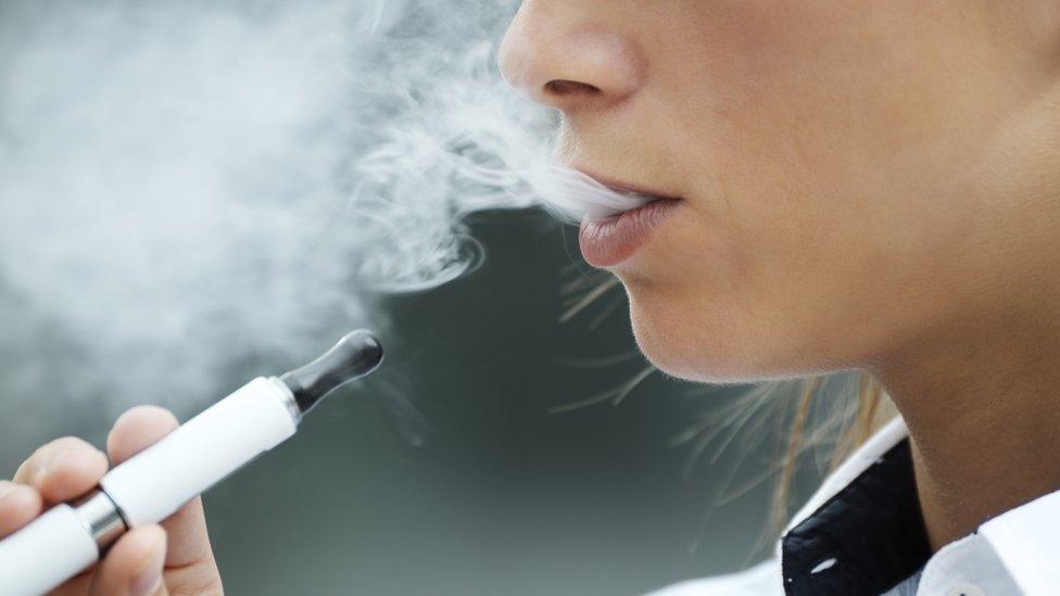 Woman smoking an electronic cigarette