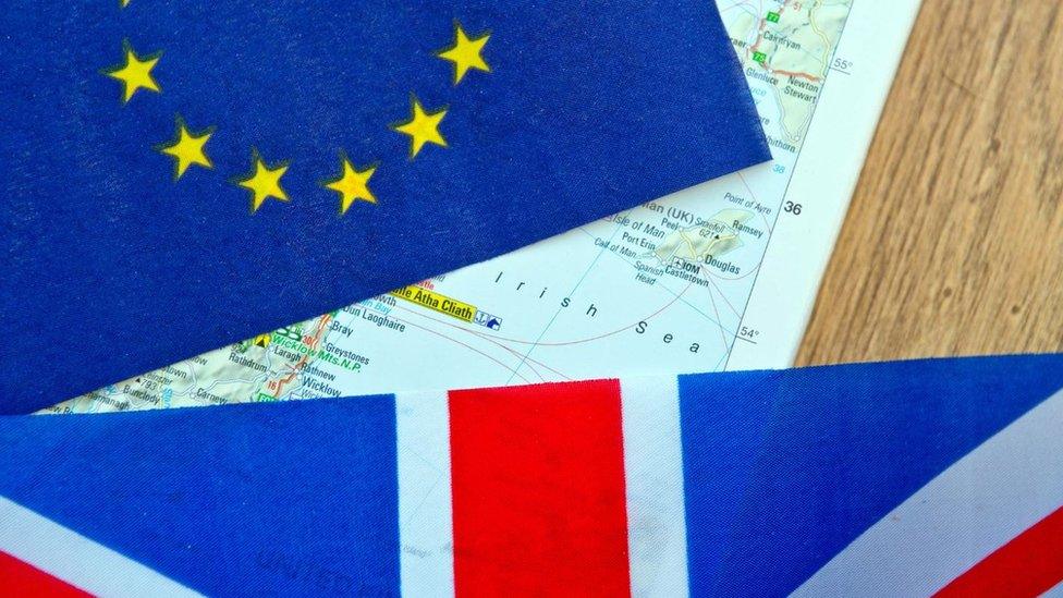 EU and union flags on top of a map showing the Irish Sea