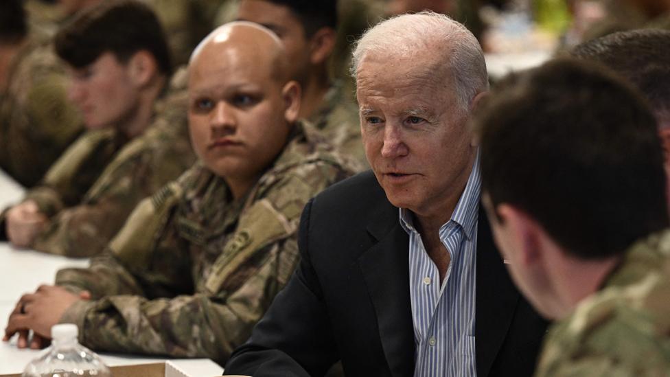 US President Joe Biden meets service members from the 82nd Airborne Division, in Poland on 25 March 2022.