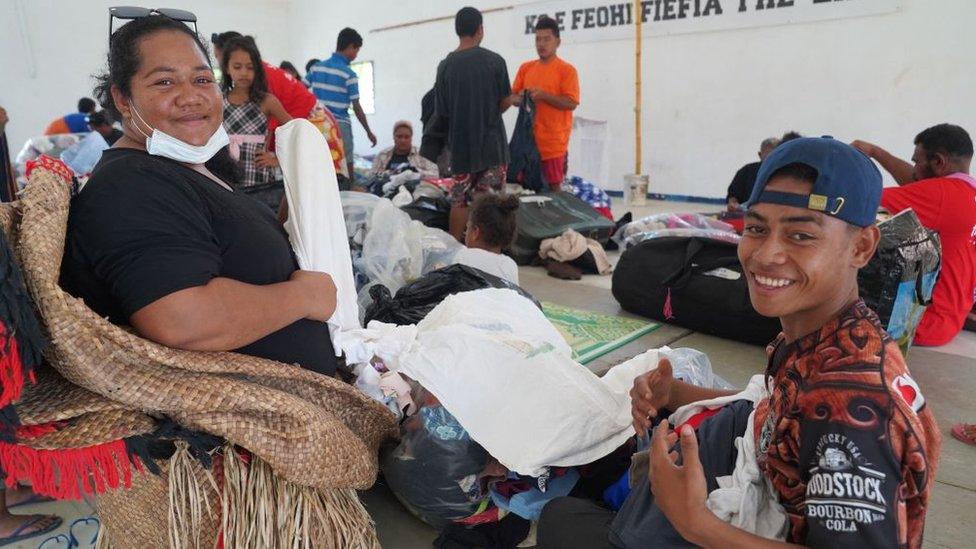 Mango Island evacuees posing as they receive clothing donations at the Free Wesleyan Church hall in Longolongo in Tonga's capital Nukualofa following the January 15 eruption of the nearby Hunga Tonga-Hunga Haapai underwater volcano.