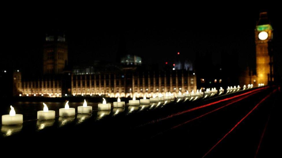 Candles burn on Westminster Bridge, Thursday evening.