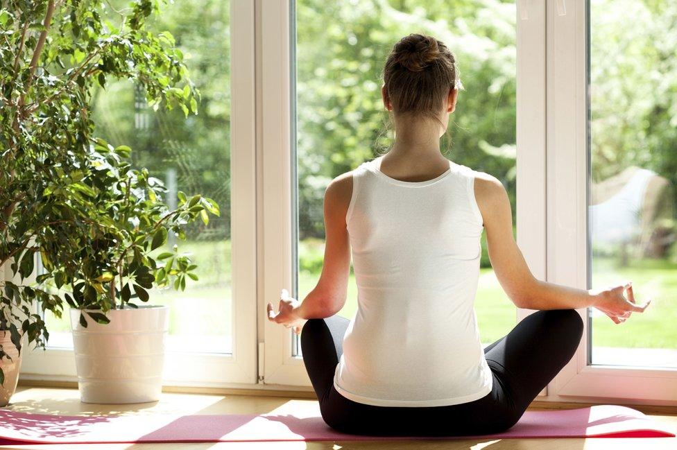 A woman meditates