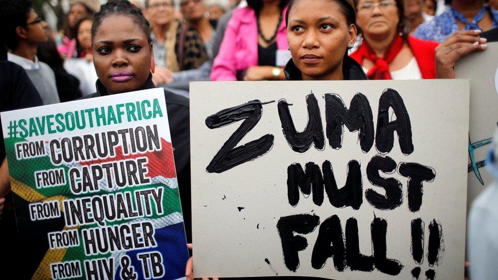 Demonstrators protest against South African President Jacob Zuma"s firing of Finance Minister Pravin Gordhan, outside Parliament in Cape Town, South Africa, March 31, 2017.