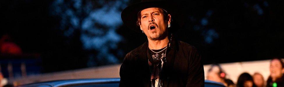 Actor Johnny Depp poses on a Cadillac before presenting his film The Libertine, at Cinemageddon at Worthy Farm in Somerset during the Glastonbury Festival