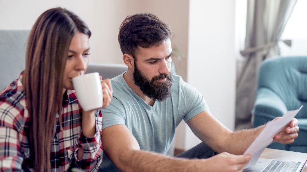 Couple looking at bills