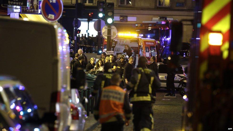 Police and rescuers work at the scene in Paris