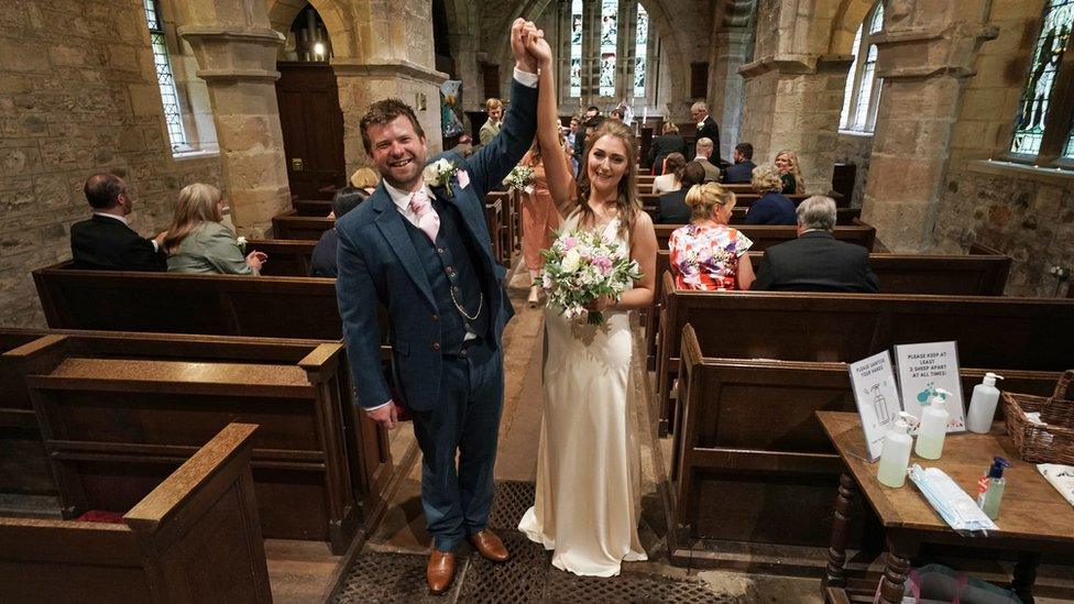 James Bone and Lucy Johnston celebrate in the church