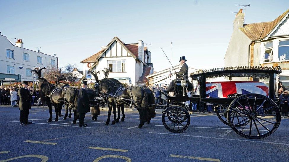 Sir David Amess's casket being taken on a horse-drawn hearse through Southend after the service