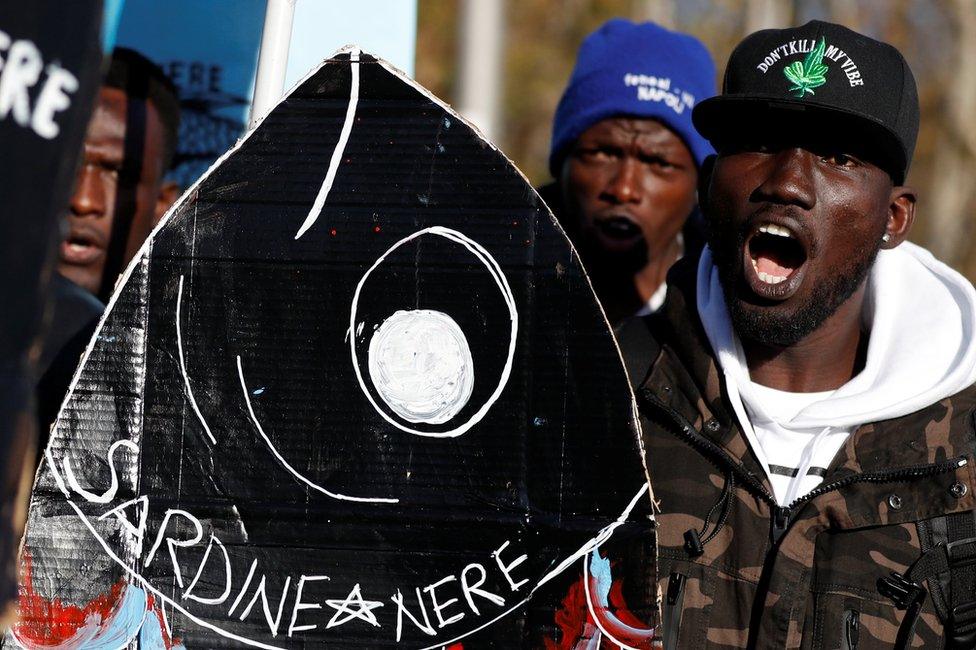 Men take part in the "Sardine Movement" rally in Rome, 14 December