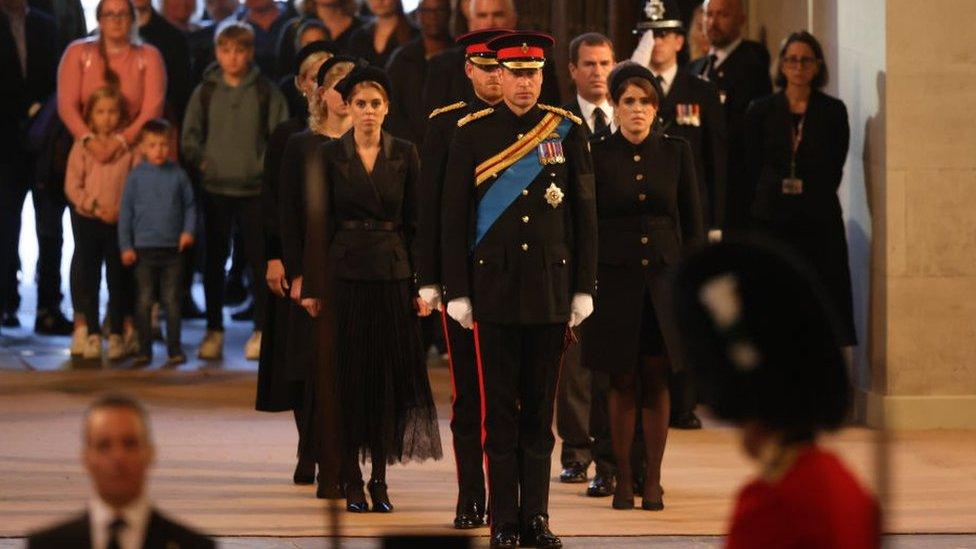 Prince William leads the queen's grandchildren in front of members of the public