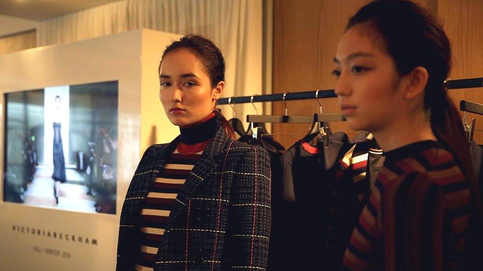 Models wearing clothes by Victoria Beckham to showcase her label in Hong Kong