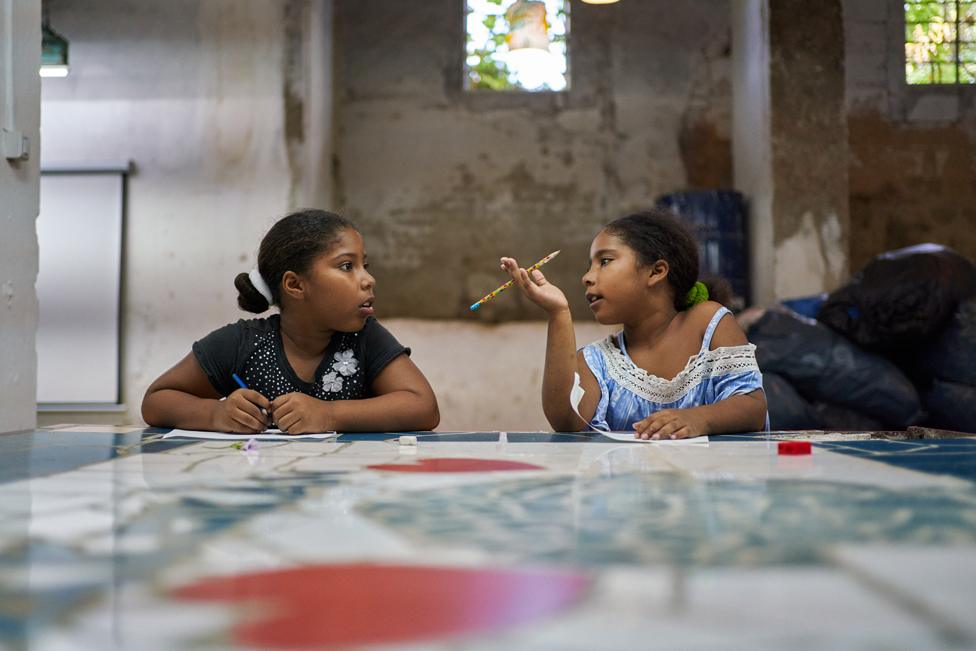 Cataleya and Caterine Larrinaga Guerra do their homework